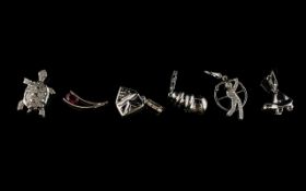 A Collection Of Six 9ct White Gold Diamond And Ruby Set Charms Each hallmarked to bale,