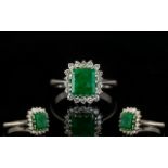 18ct White Gold Attractive Emerald And Diamond Cluster Ring Fully hallmarked,