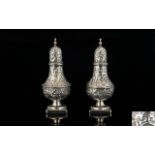 Victorian Period - Persian Style Pair of Ornate Solid Silver Pepperettes with Extensive Embossed