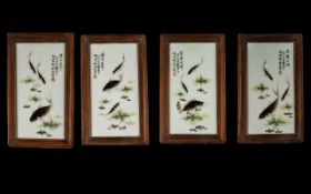 Set Of Four Oriental Wall Plaques Painted tiles, each framed,