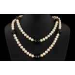 A Cultured Pearl And Topaz Bead Necklace