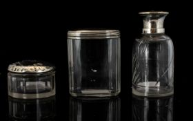 Two Silver Topped Glass Vanity Jars To i