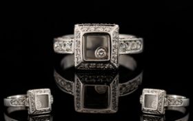 An 18ct White Gold And Diamond Set Chopa