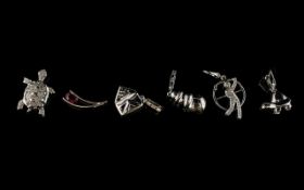 A Collection Of Six 9ct White Gold Diamond And Ruby Set Charms Each hallmarked to bale, to include