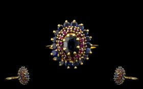 Ladies 9ct Gold Ruby and Sapphire Dress Ring, Flower Head Setting. Not Marked but Tests old.