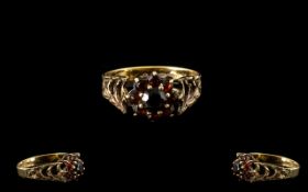 9ct Gold Garnet Set Cluster Ring With open worked shoulders.