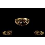 9ct Gold Garnet Set Cluster Ring With open worked shoulders.