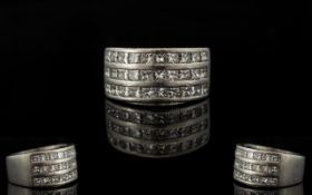 Platinum And Diamond Set Superb And Attractive Contemporary Ring Comprising three rows of ten