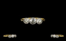 18ct Gold and Platinum Attractive 3 Stone Diamond Set Dress Ring of Pleasing Form.