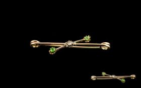 9ct Yellow Gold And Diamond And Emerald Bar Brooch Stamped 9ct, the centre set with two faceted