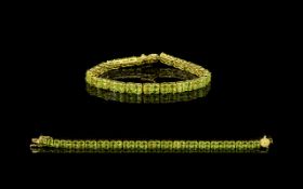 Peridot Double Row Tennis Bracelet, comprising two matching rows of oval cut peridots,