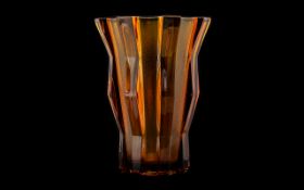 A Czech Glass Brutalist Form Vase Mid century vase in amber glass with textural opaque panels.
