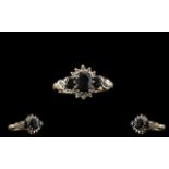 9ct Gold Attractive Diamond And Sapphire Set Dress Ring The central sapphire surrounded by 10