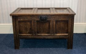 An Oak Panelled Coffer of traditional form, panelled throughout, hinged top. Width 39", Height 24".