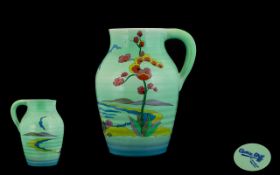 Clarice Cliff For Wilkinson One Handled Jug a turquoise ground jug with painted decoration of