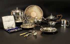 A Small Mixed Lot Of Antique Silver Plated Ware To include a three piece tea service of shaped form