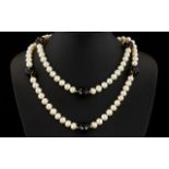 A Cultured Pearl And Topaz Bead Necklace With 14ct Gold Clasp Very long, elegant necklace comprising
