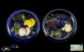 William Moorcroft Signed Pair Of Small Inverted Dishes 'Plums And Lemons' pattern on cobalt blue