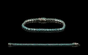 Paraibe Apatite Tennis Bracelet, a row of oval cut paraibe apatites, of the classic,
