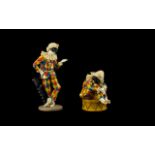 Two Resin Figurines In The Form Of Columbine From The Commedia Dell’Arte Comprising standing figure,