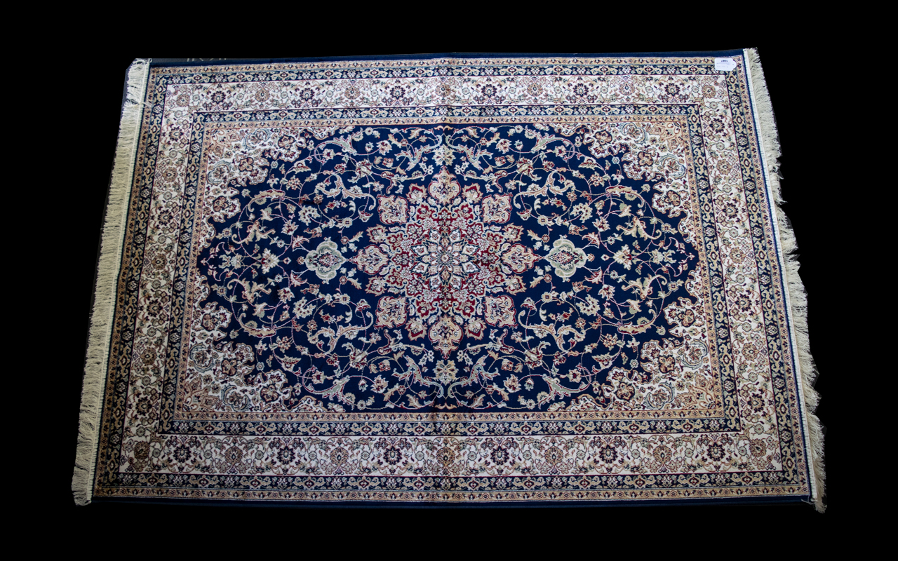 A Large Woven Silk Carpet Keshan rug with blue ground and traditional Middle Eastern floral and