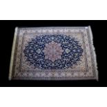 A Large Woven Silk Carpet Keshan rug with blue ground and traditional Middle Eastern floral and