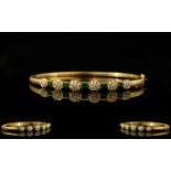 18ct Gold - Attractive Emerald and Diamond Hinged Bangle Set with Six Diamond Flower head