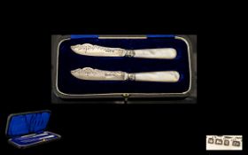 Edwardian Period Boxed Pair of Children's Mother of Pearl and Silver Handles Fish Knifes.