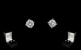 A Pair Of 18ct White Gold Diamond Stud Earrings Each set with a round modern brilliant cut diamond,