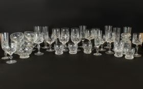 A Large Quantity Of Cut Glass Drinking Vessels All with star form cut design,