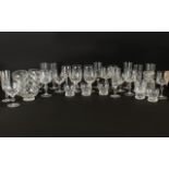 A Large Quantity Of Cut Glass Drinking Vessels All with star form cut design,