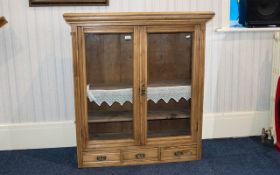 A Pine Kitchen Display Cabinet wall mounted, of typical form, glazed doors,