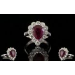 18ct White Gold Superb Pear Shaped Ruby And Diamond Cluster Ring Of stunning quality, the central