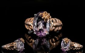Rose de France Amethyst Butterfly Decorated Solitaire Ring, a 5.25ct oval cut Rose de France
