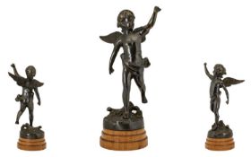 A Cast Metal Figure In The Form Of A Classical Winged Putti Bronzed metal figure raised on stepped