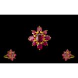 Ruby Flower Shape Ring, the centre oval cut ruby, of 3.75cts, surrounded by a further eight oval cut