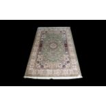 A Very Large Woven Silk Carpet Keshan rug with Eau De Nil ground and traditional Middle Eastern