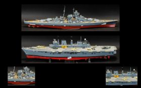 Two British Model War Ships including a Large aircraft carrier .
