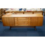 A Mid Century Teak Sideboard Of Typical form,