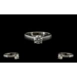 A Single Stone White Gold Diamond Ring Set with a round modern brilliant cut diamond,