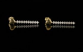 Pair Of 9ct Gold Diamond Drop Earrings Heart shaped stud above a diamond row, fully hallmarked