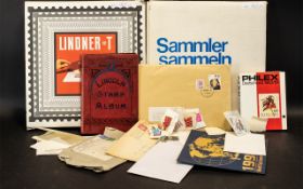 Two Albums Containing A Quantity Of Stamps Lindnet T - album complete with outer slip case,