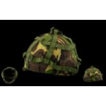 MILITARY HELMET. Army helmet with camouflage covering, please see accompanying image.