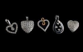A Collection Of Six 9ct White Gold Diamond Set Charms Each hallmarked to bale, to include four heart