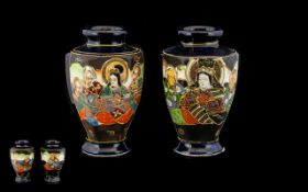 A Pair Of Japanese Vases 20th century hexagonal form vases glazed in midnight blue,