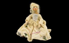 A Vintage Wax Doll Handmade doll with wired armature, cloth body, wax feet, hands and head.