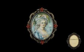 Antique Portrait Miniature Mounted in white metal frame with coral cabochon and marcasite ribbon and