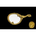 Art Nouveau Style Brass Hand Mirror Of oval form in embossed sinuous brass whiplash frame with