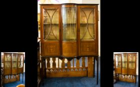 Edwardian Bow Fronted Display Cabinet, with astral glazed doors and inlaid decoration. Raised on