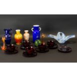 A Collection Of Decorative Glass Items To include five red moulded carnival glass cups and saucers,